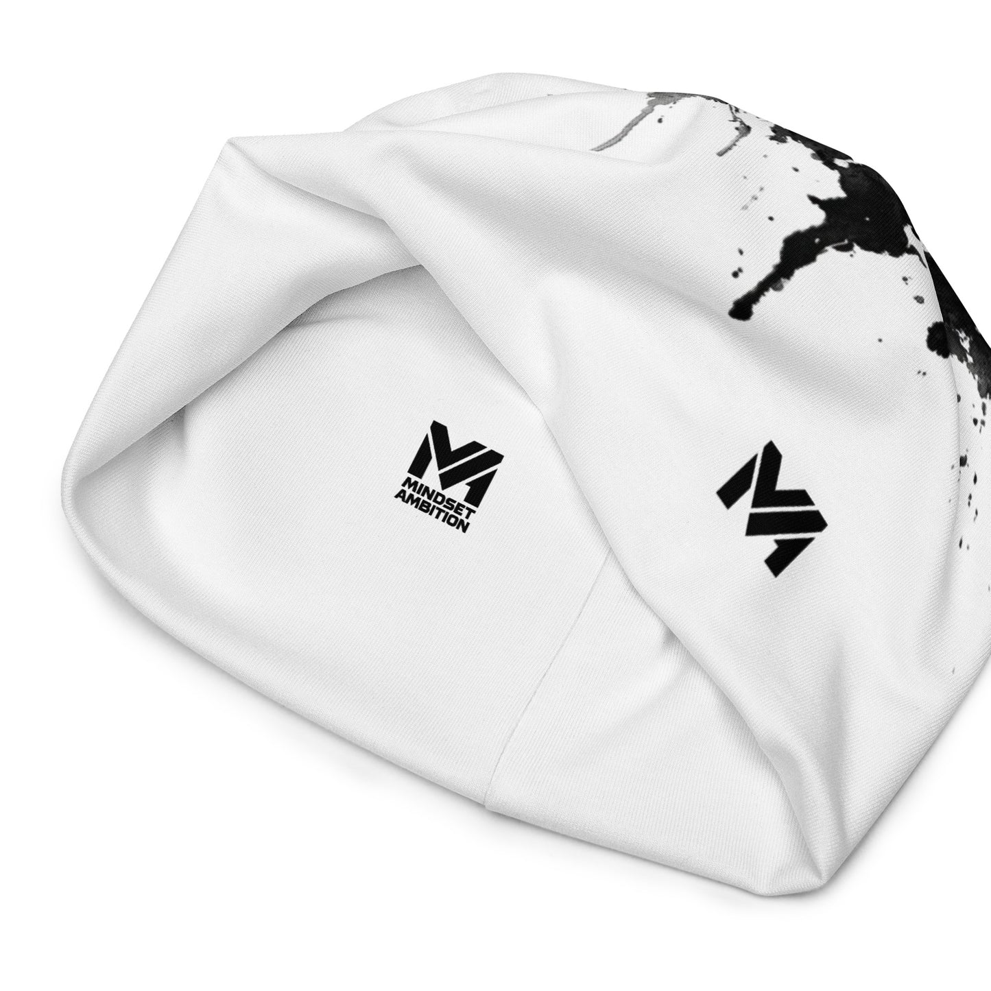 Bonnet Flow Drip Mindset Ambition, version blanche avec éclaboussures de peinture noire et logo imprimé noir, vue intérieure du bonnet affichant la signature Mindset Ambition – Mindset Ambition