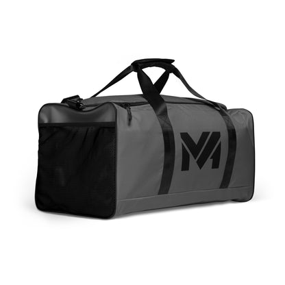 Sac Bold Move Mindset Ambition, gris, vue avant trois-quarts droite, logo noir centré, poches latérales et finitions robustes – Mindset Ambition