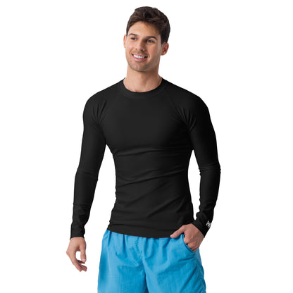 T-shirt sport homme Shield Mindset Ambition, noir, manches longues, porté par un homme de face, logo blanc centré en haut du dos et sur le poignet gauche.
