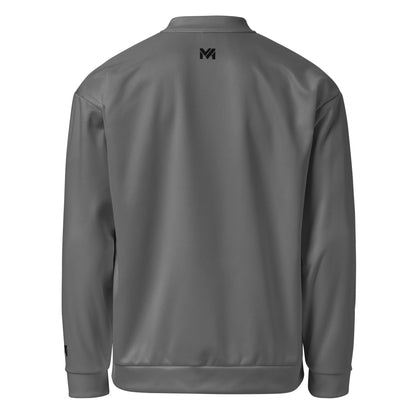 Veste de sport Momentum Mindset Ambition, grise, vue de dos avec logo noir centré en haut du dos et sur le poignet gauche.