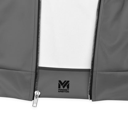Détail de la veste de sport Momentum Mindset Ambition grise, fermeture éclair métallique et logo noir sur la base, finitions précises et tissu technique premium – Mindset Ambition