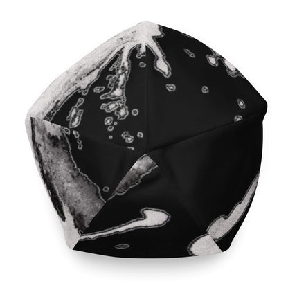 Vue du dessus du bonnet Flow Ink noir à tache de peinture blanche, design artistique et moderne – Collection Détail & Élégance Mindset Ambition.