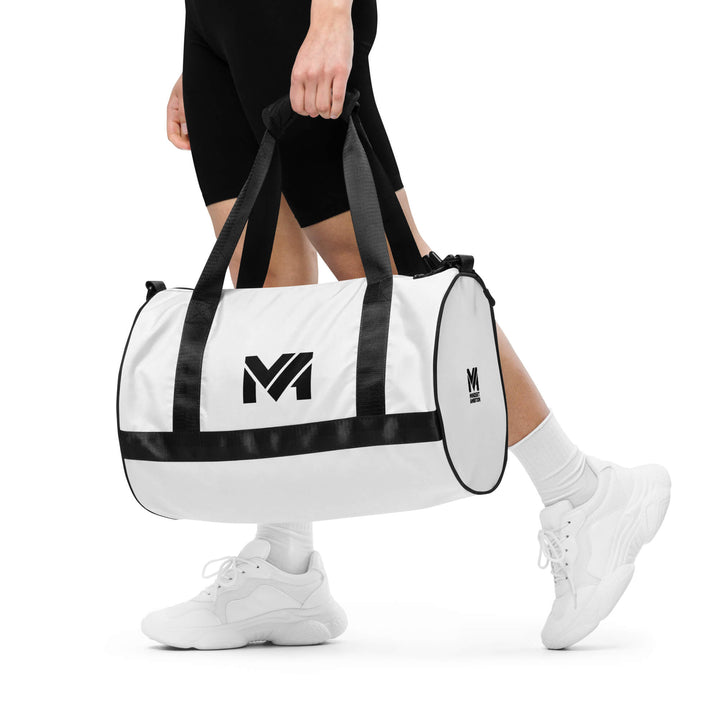 Sac de sport Smart Move Mindset Ambition, blanc, porté à la main, logo noir centré sur le côté.